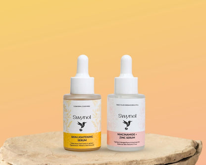 Niacinamide + Zinc Serum and Skin Lightening Serum approaching each other, designed to treat acne, pigmentation, dark spots, and enhance skin clarity.