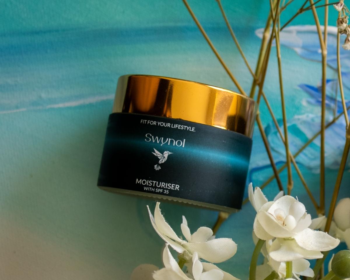 A sleek bottle of SWYNOL Moisturizer with SPF 35 is shown, highlighting its skin-protecting and hydrating formula in a clean, professional layout.